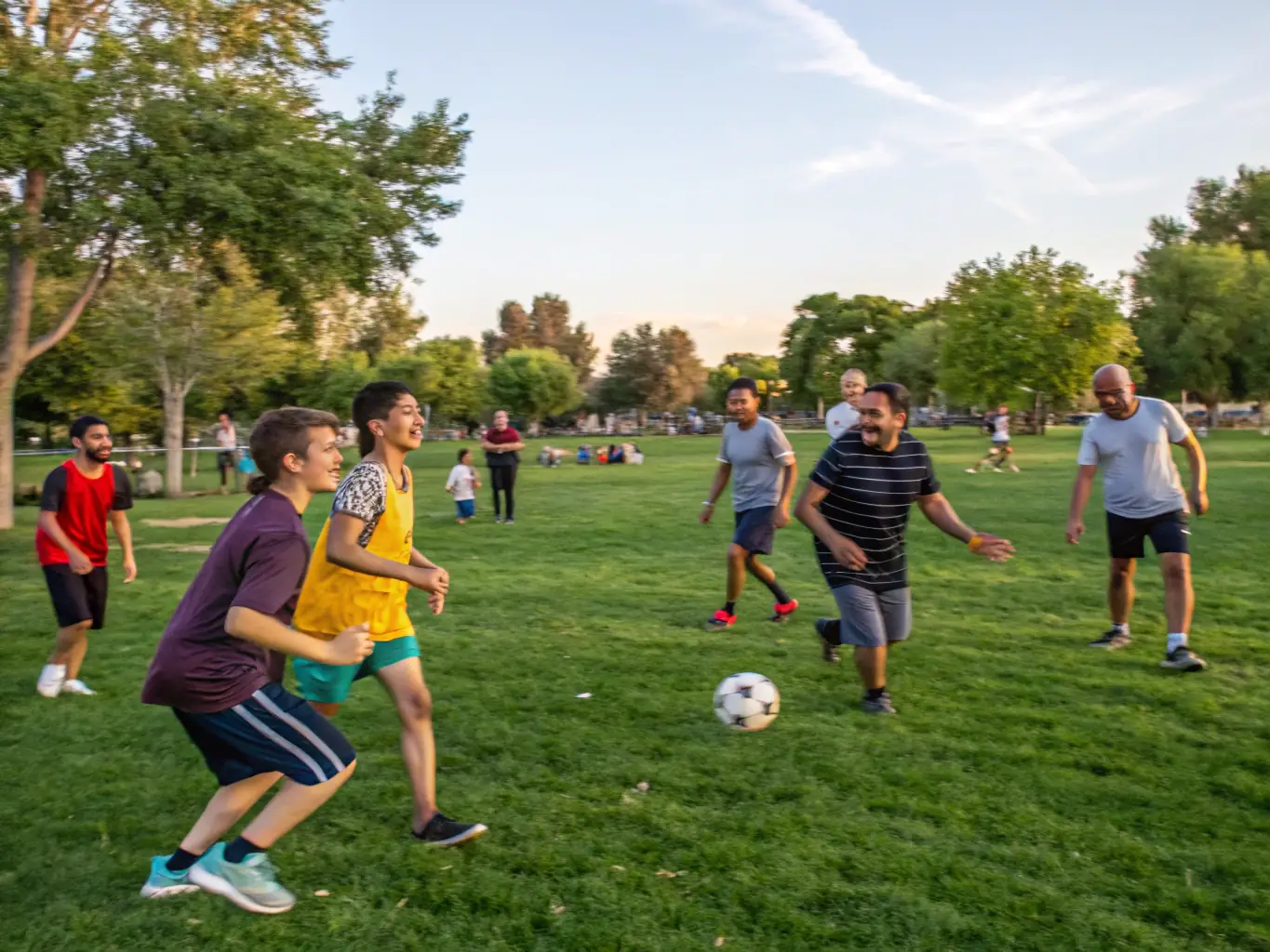 A group of young people participating in a recreational activity in a safe and well-maintained outdoor space, emphasizing community engagement.